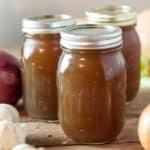 Jars filled with vegetable stock.