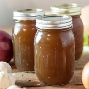 Jars filled with vegetable stock.
