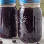 Blueberry filling in glass mason jars.