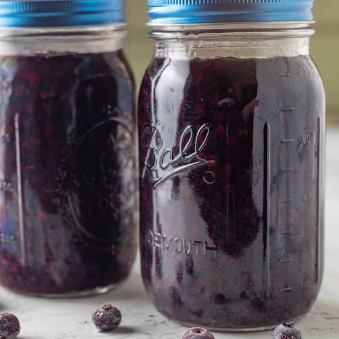 Blueberry filling in glass mason jars.