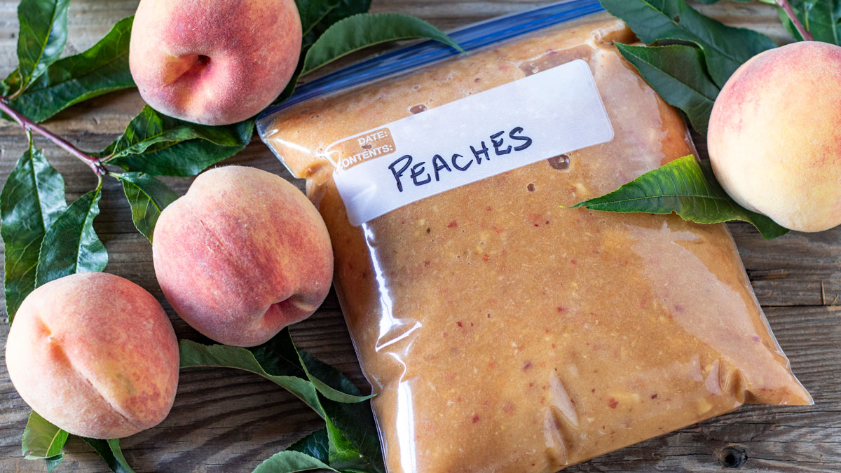 Jars of homemade peach syrup.