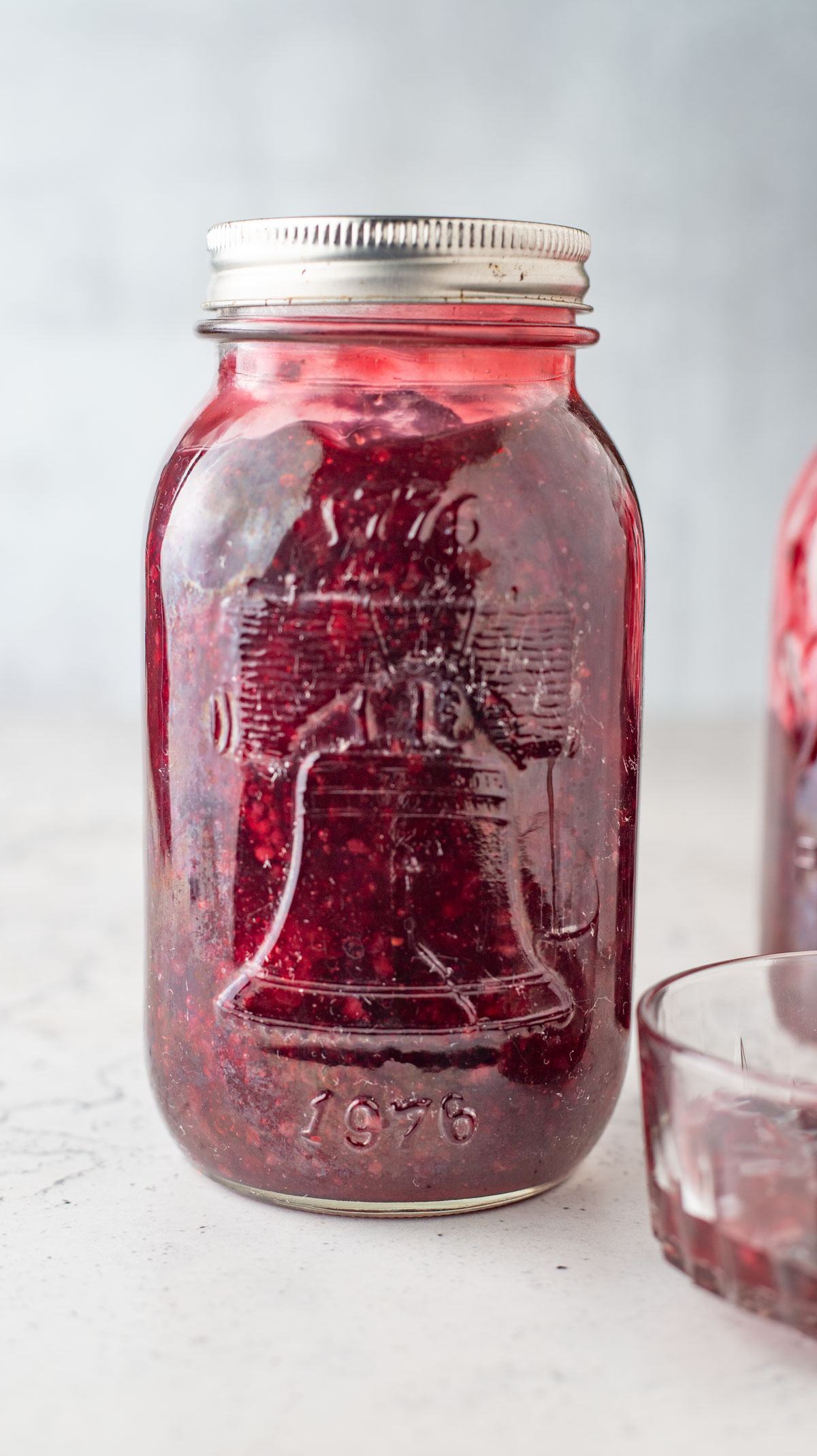 Quart jar with blackberry filling.