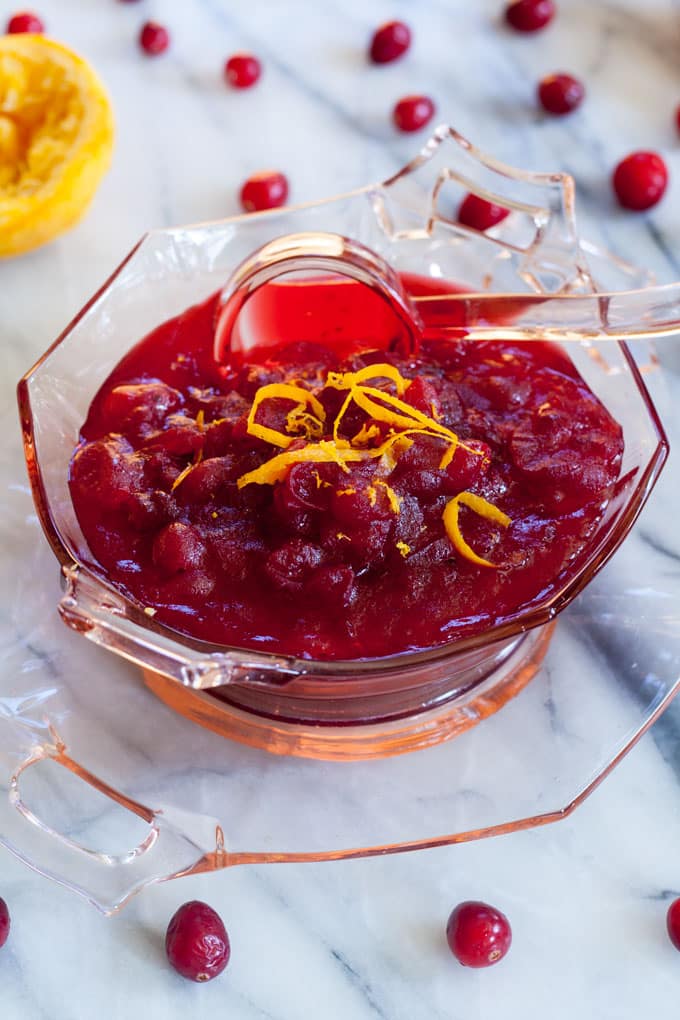 Antique serving bowl with cranberry sauce.