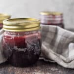 Close up of jar of raspberry syrup.