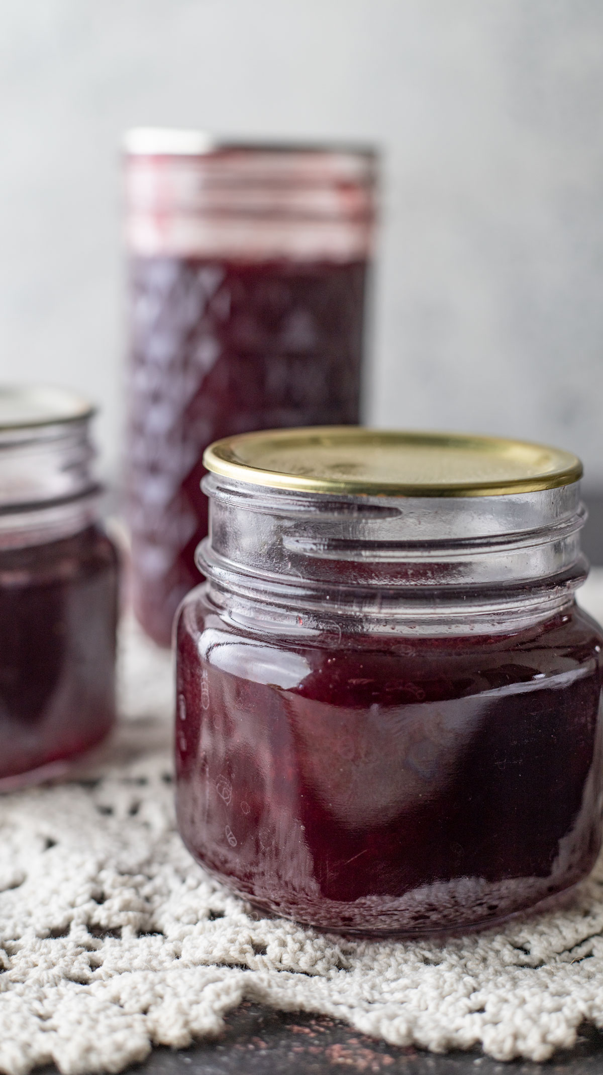 Three jars of jam close up photo.