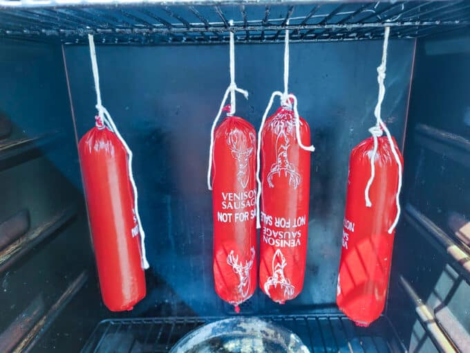 Sausages hung in smoker.