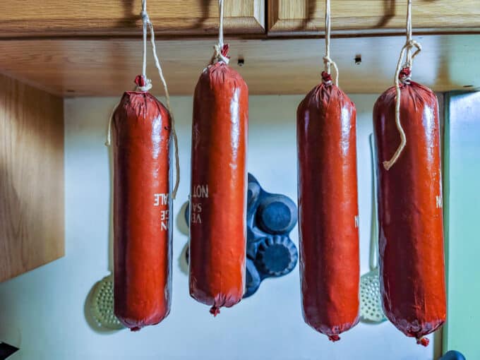 Smoked sausage hung to cool.