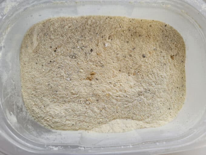 Mixed spices in plastic bowl.