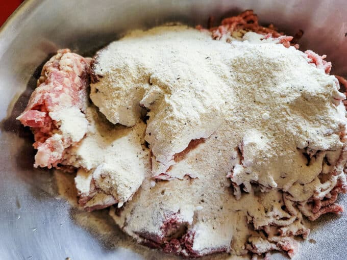 Spices and cure added to meat.