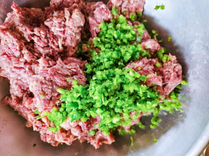 Jalapeños added to meat mixture.