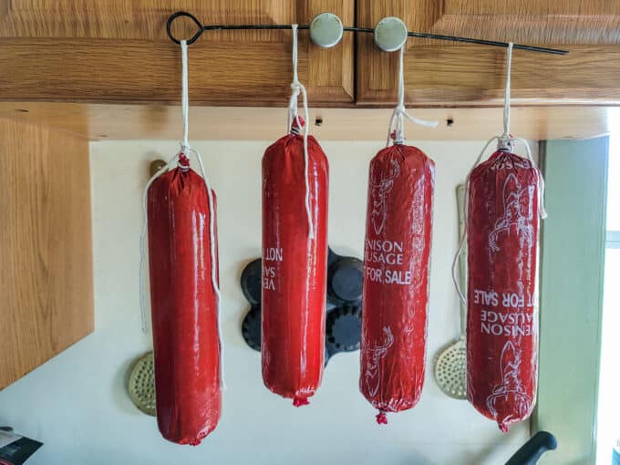 Filled sausage hung to dry before smoking.