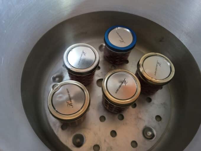 Jars added to canning pot.