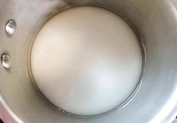 Sugar and water in a pan.