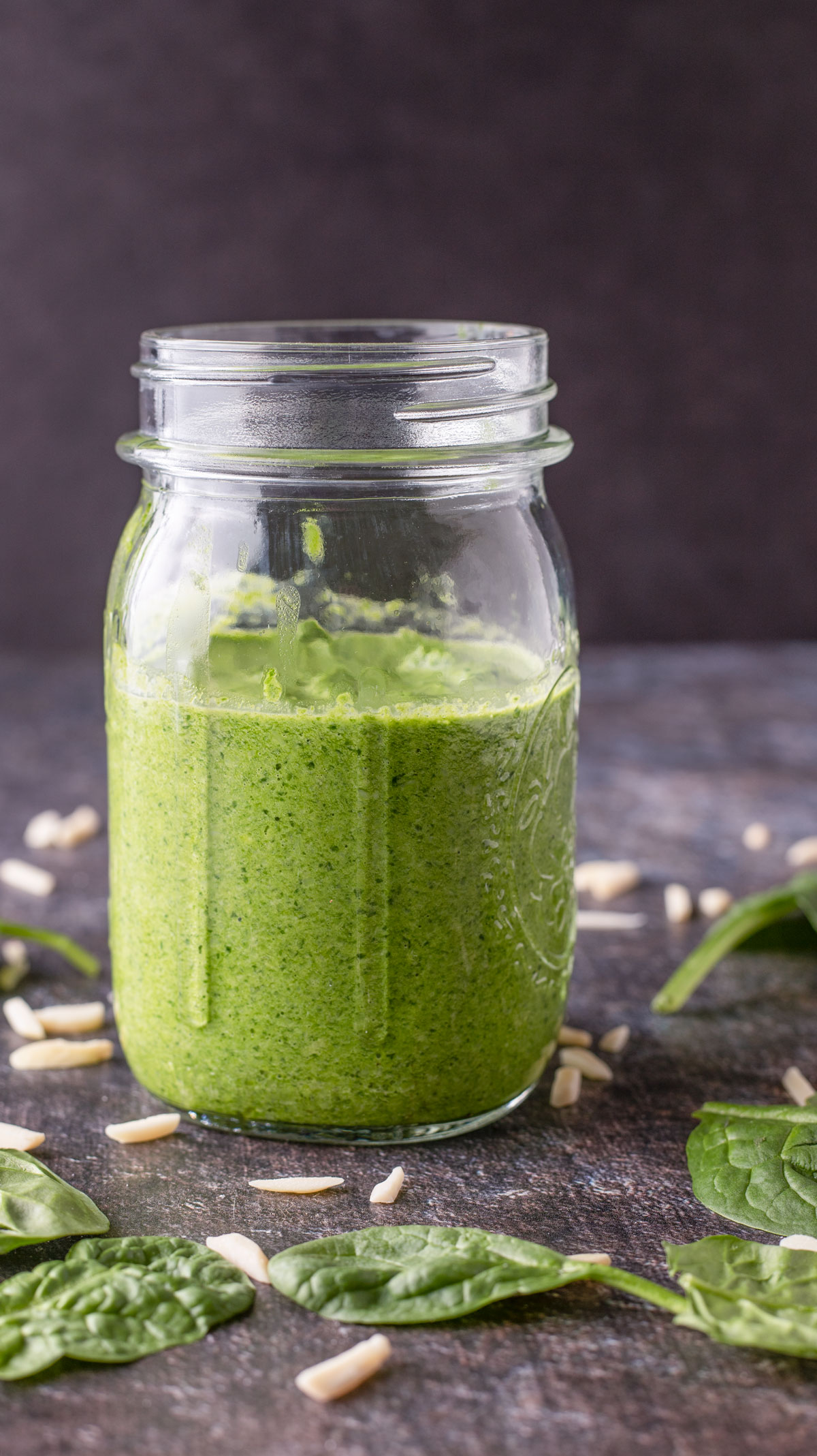 Close up of Spinach pesto in mason jar.