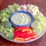 Chive dip surrounded by crue de ta