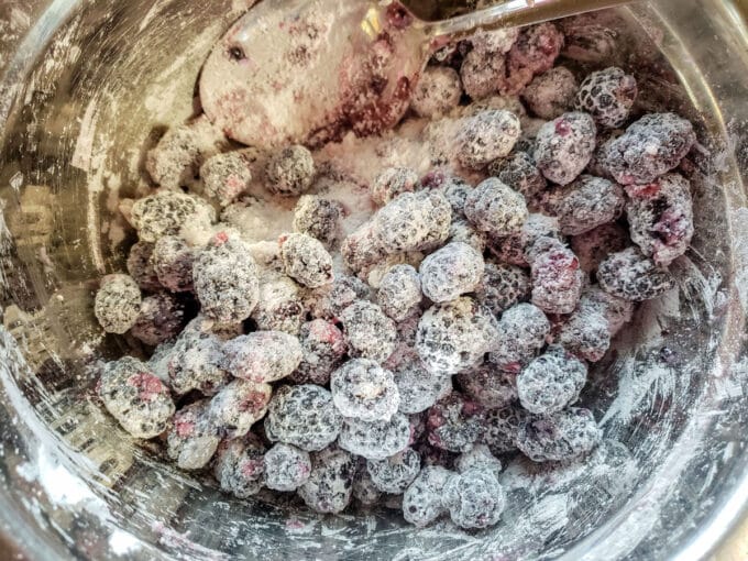 Blackberry pie filling mixed together in bowl.