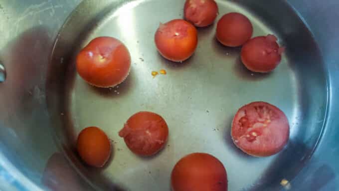 Tomatoes added to large pot to blanch.