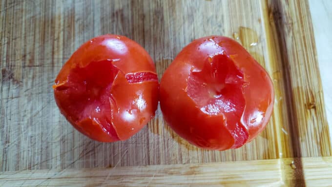 Split skin of tomatoes.
