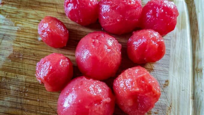 Peeled tomatoes on board.