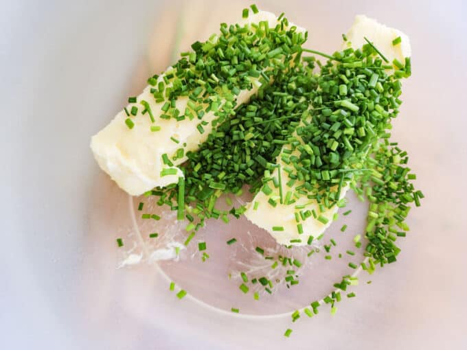 Chopped chives added to butter sticks.