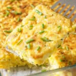 Spatula lifting out piece of corn casserole.