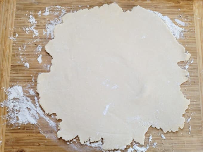 Rolled out pie crust on floured board.
