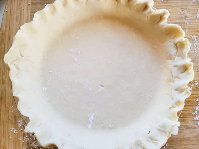 Crimped pie crust in pie plate.