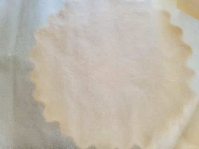 Piece of waxed paper laid onto crust.