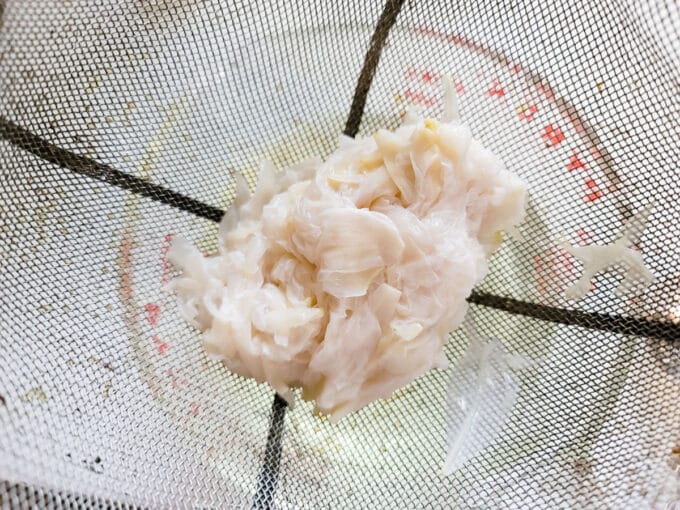 Peony petals in sieve.