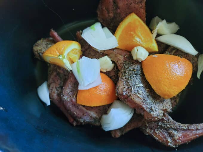 Rabbit pieces in crockpot.