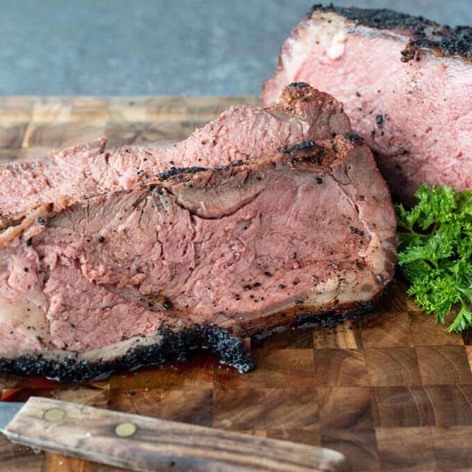 Slice smoked beef on cutting board.