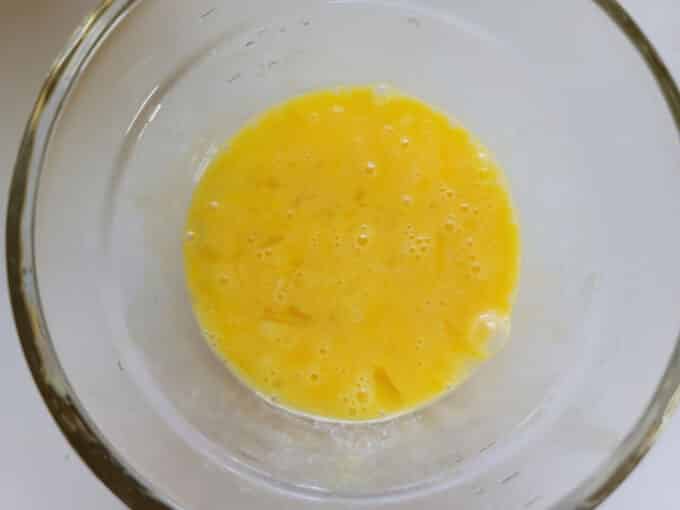 Whisked eggs in bowl.