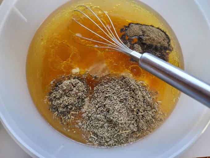 Marinade ingredients added to bowl.