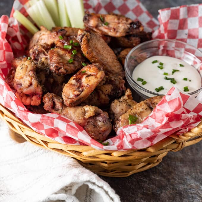 Smoked chicken wings in a basket.