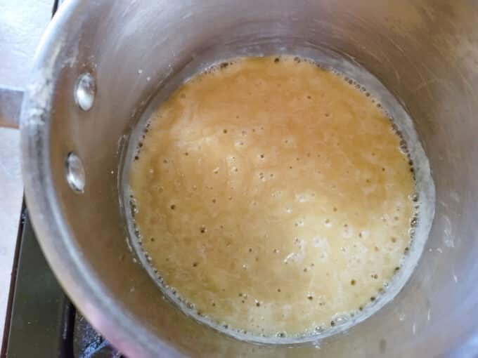 Roux bubbling in pan.