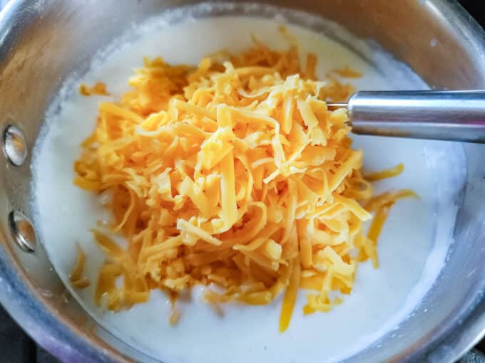 Cheddar added to sauce.