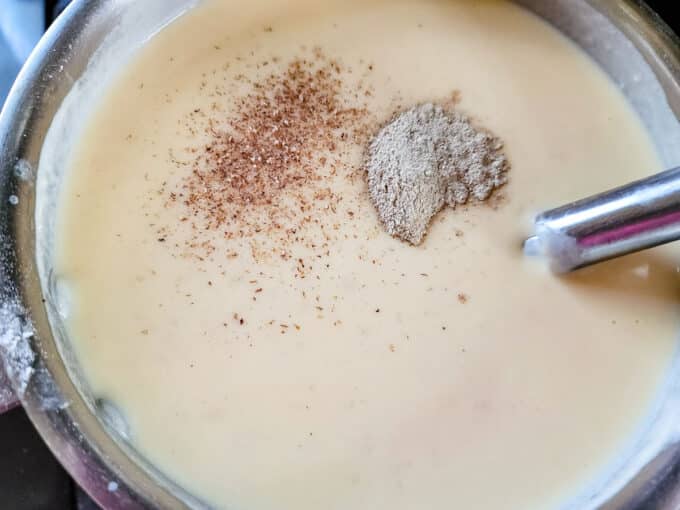 Spices added to sauce.