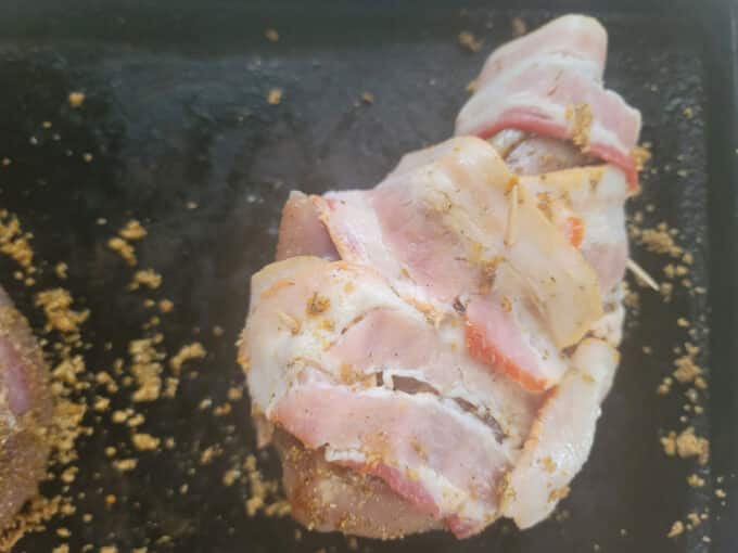 Rubbed breast wrapped in bacon.