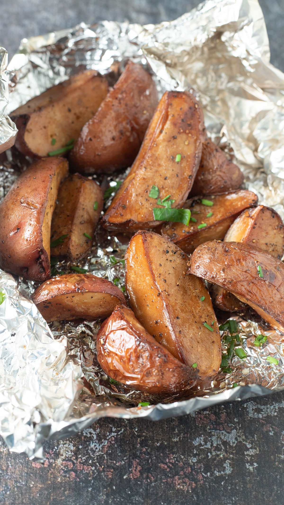 Crispy smoked potatoes garnished with parsley.