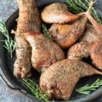 Smoked rabbit on metal platter.