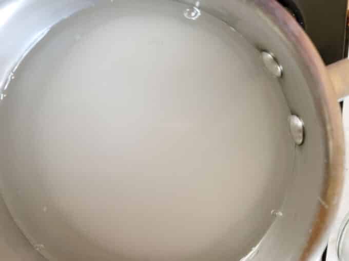 Water added to pot with salt and sugar.