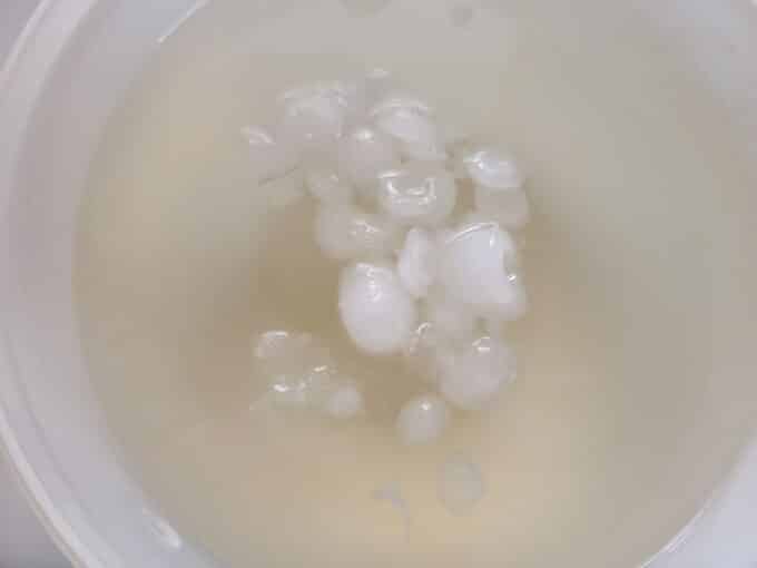 Ice cubes in bowl with brine.