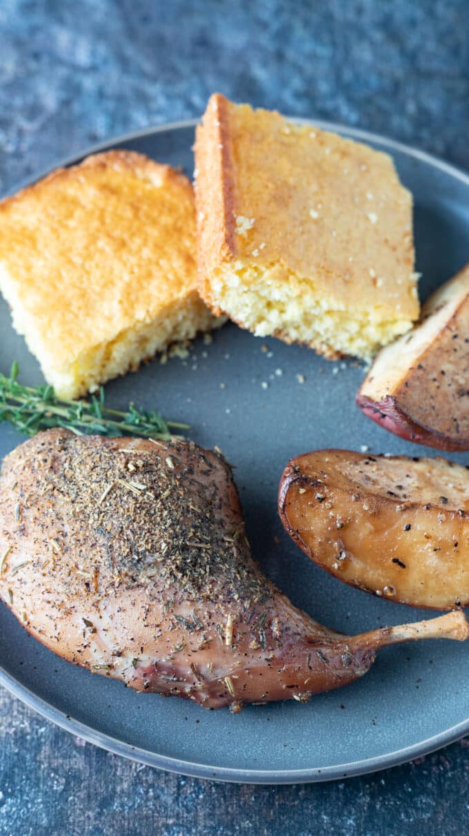 Rabbit leg with cornbread and smoked potatoes.