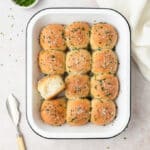 12 rolls in white baking pan.