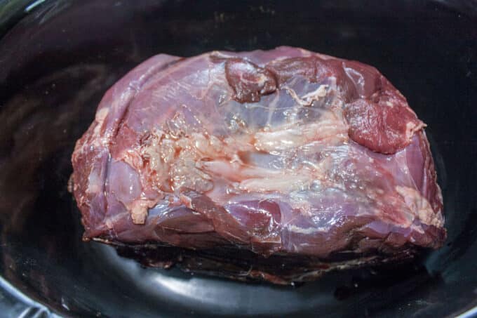 Roast added to slow cooker.