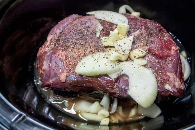 Water added to the bottom of slow cooker.