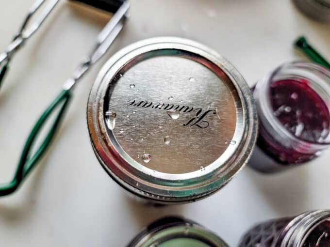 Band screwed onto jar.