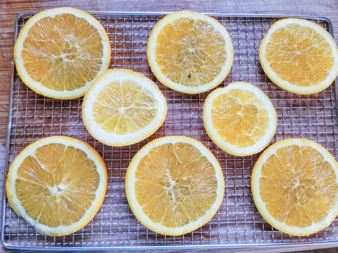 Single layer of orange slices on rack.