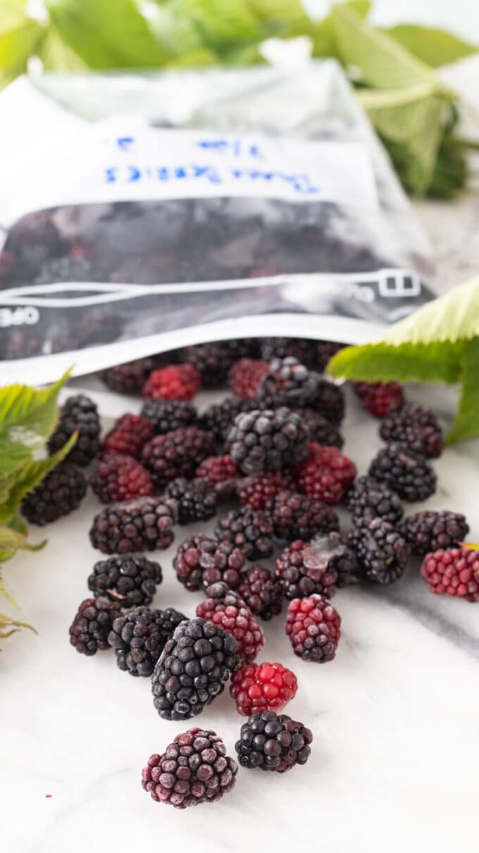 Frozen blackberries and leaves.