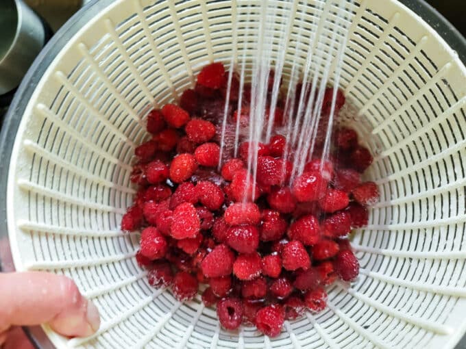 Spray off the berries.